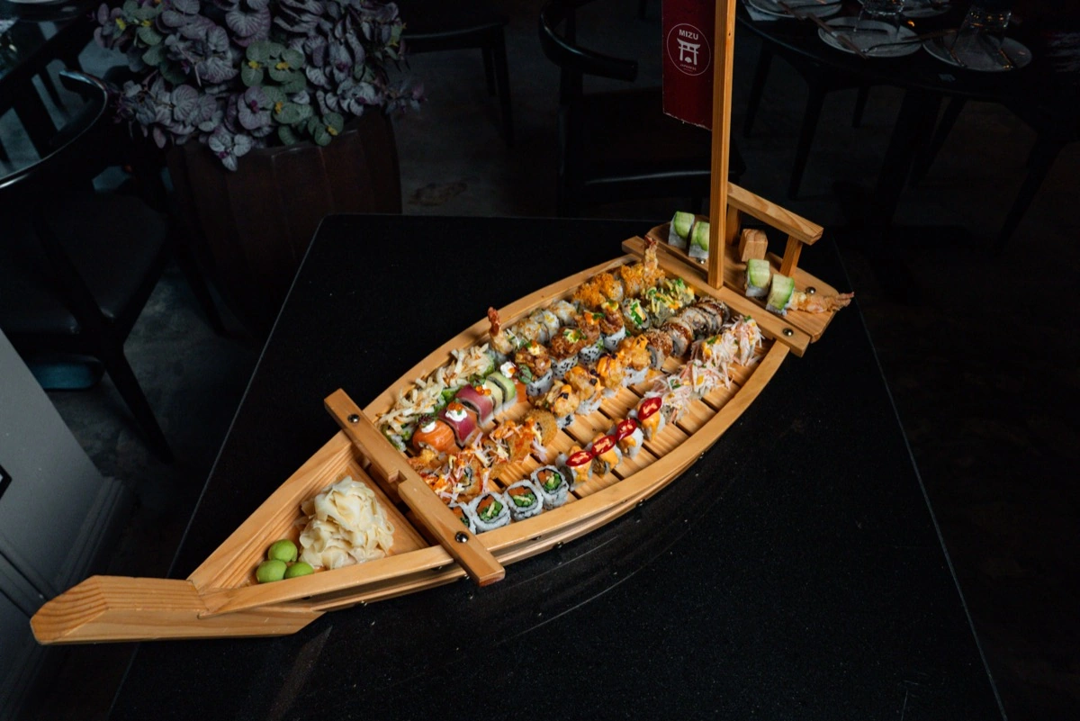 Mizu sushi boat platter with assorted signature rolls